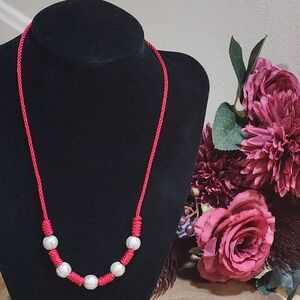 Red Knotted Cord Necklace With Textured Glittery Silver Beads